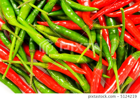 Red and green chili peppers at the background Red and green chili peppers at the background 5124219