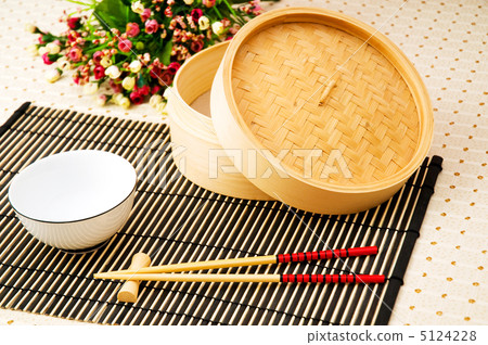Chopsticks and bowl on the bamboo mat Chopsticks and bowl on the bamboo mat 5124228