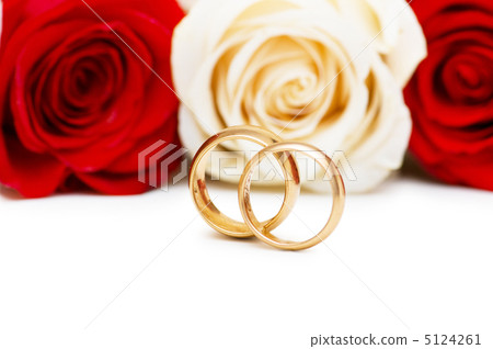 Roses and wedding ring isolated on the white Roses and wedding ring isolated on the white 5124261