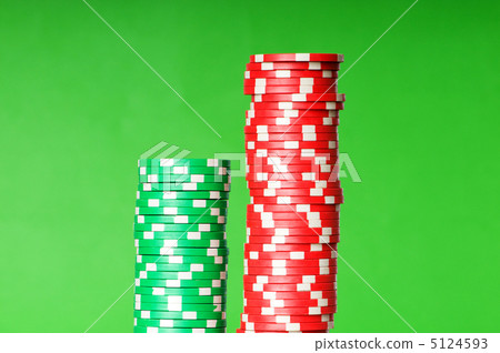 Stack of casino chips against green background 5124593