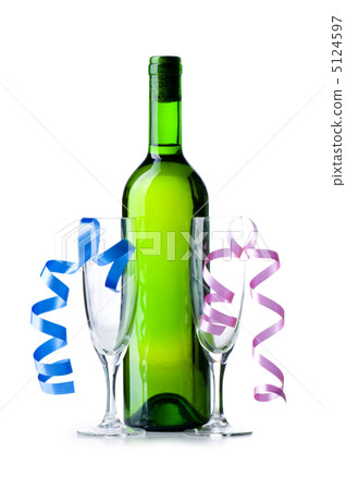 Bottle of wine and glass with streamer on white 5124597