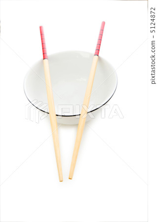Bowl and chopsticks on the bamboo mat 5124872