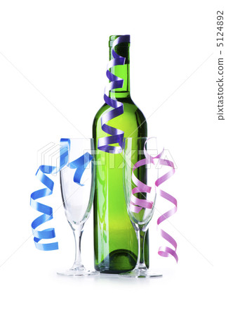 Bottle of wine and glass with streamer on white 5124892
