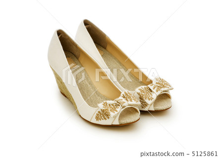 Woman shoes isolated on the white background Woman shoes isolated on the white background 5125861