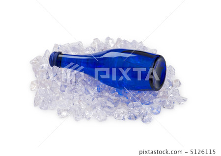 Green bottle of water on ice cubes 5126115
