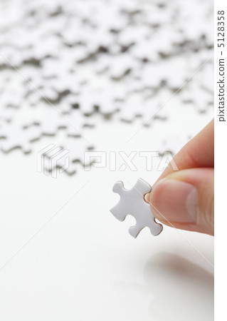 Jigsaw puzzle and hand Jigsaw puzzle and hand 5128358