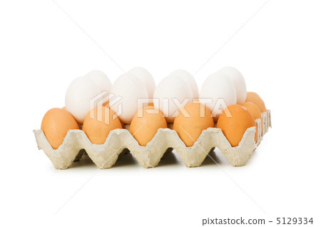 Lots of eggs in the carton isolated on white 5129334