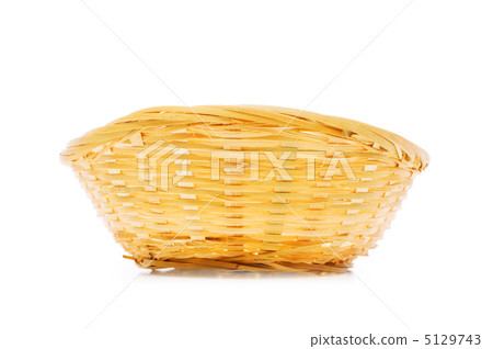 Woven basket isolated on the white background Woven basket isolated on the white background 5129743