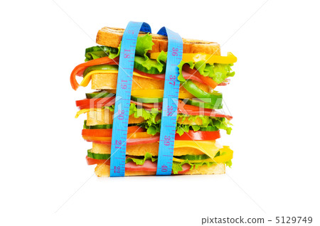 Concept of healthy food with tape measure and sandwich 5129749