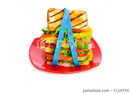 Concept of healthy food with tape measure and sandwich Concept of healthy food with tape measure and sandwich 5129750