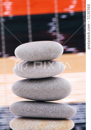 Stack of spa pebbles against blurred background 5130368