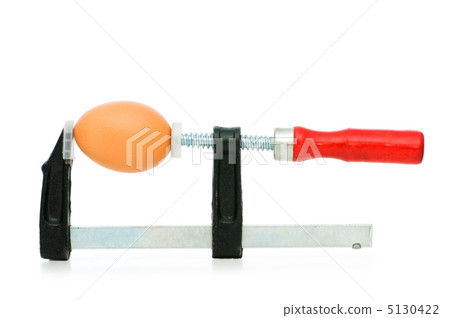 Strength concept with egg and clamp on white 5130422