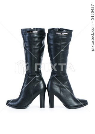 Black boots isolated on the white background Black boots isolated on the white background 5130427