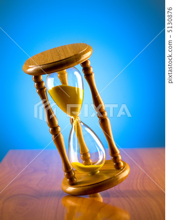 Time concept with hourglass against background Time concept with hourglass against background 5130876