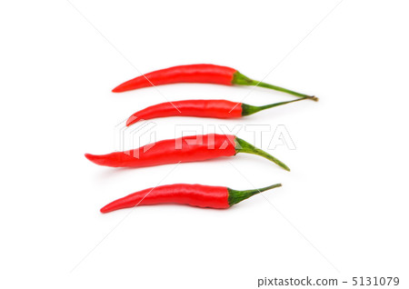 Red chili peppers isolated on the white Red chili peppers isolated on the white 5131079