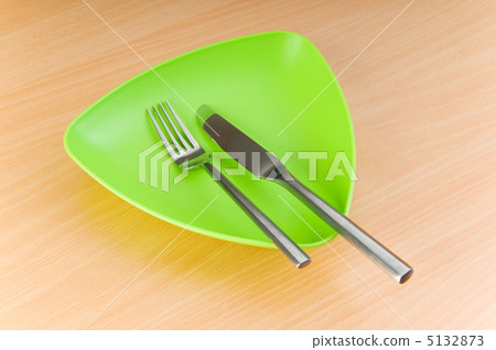 Plate with utensils on wooden table Plate with utensils on wooden table 5132873