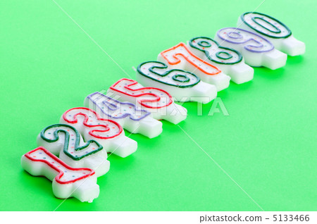 Birthday candles against colourful background 5133466