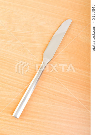 Table utensils on the wooden table 5133843