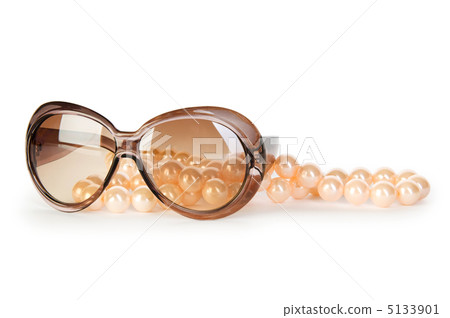 Pearl necklace and sunglasses isolated on the white background Pearl necklace and sunglasses isolated on the white background 5133901