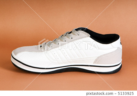 Sport shoes against the dark background Sport shoes against the dark background 5133925