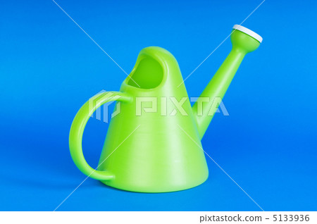 Gardening concept with green watering can on background Gardening concept with green watering can on background 5133936
