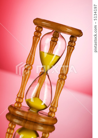 Time concept - hourglass against the gradient background 5134197