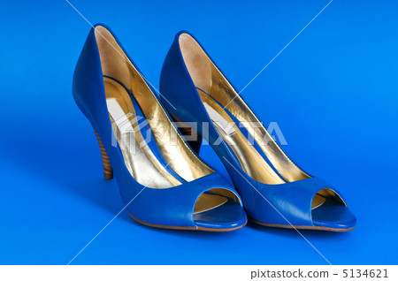 Fashion concept with blue woman shoes on high heels 5134621