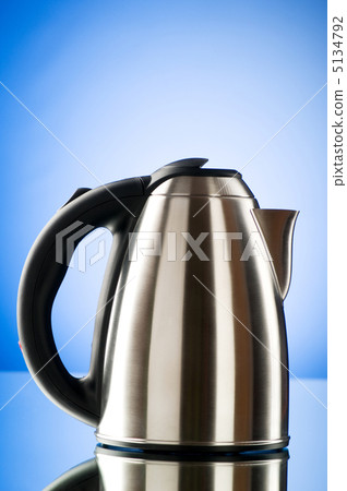 Shiny kettle against the colorful gradient background 5134792