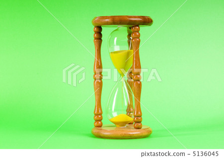 Time concept - hourglass against the gradient background Time concept - hourglass against the gradient background 5136045