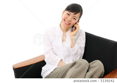 A girl calling with a smart phone A girl calling with a smart phone 5139242