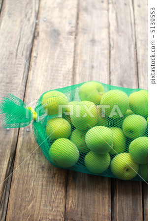 Unripe Nanko plums grown without pesticides in a net Unripe Nanko plums grown without pesticides in a net 5139553