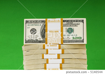 Stack of dollars isolated on the green Stack of dollars isolated on the green 5140544