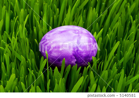 Easter concept - colourful eggs in green glass Easter concept - colourful eggs in green glass 5140581