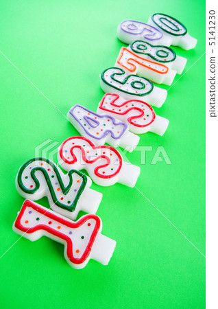 Birthday candles against colourful background Birthday candles against colourful background 5141230