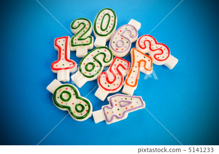 Birthday candles against colourful background Birthday candles against colourful background 5141233