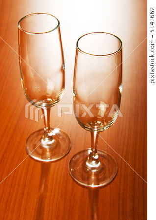 Wine glasses against wooden background Wine glasses against wooden background 5141662