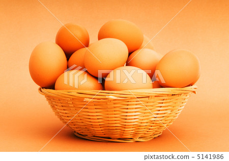 Basket of eggs on the colourful background Basket of eggs on the colourful background 5141986