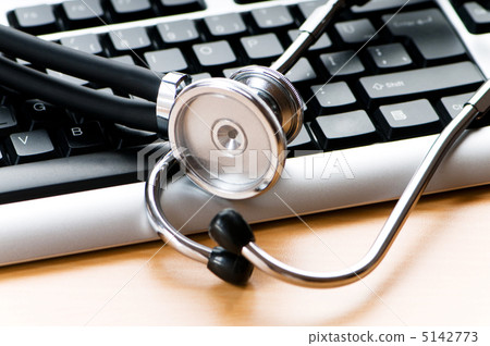 Stethoscope and keyboard illustrating concept of digital securit 5142773