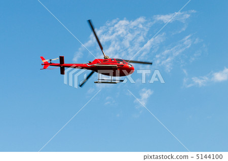 Red helicopter on the bright summer day 5144100