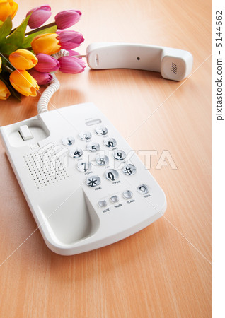 Romantic concept with phone and tulip flowers Romantic concept with phone and tulip flowers 5144662