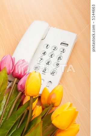 Romantic concept with phone and tulip flowers Romantic concept with phone and tulip flowers 5144663