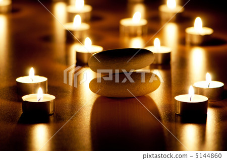 Burning candles and pebbles for aromatherapy session 5144860