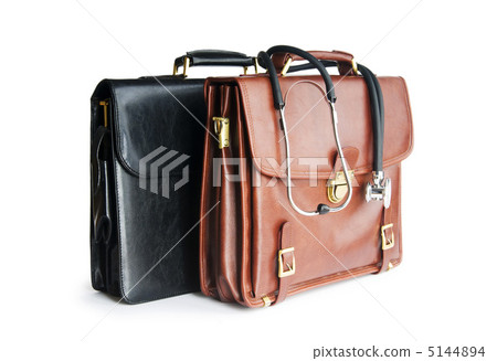 Cases and stethoscope isolated on the white Cases and stethoscope isolated on the white 5144894