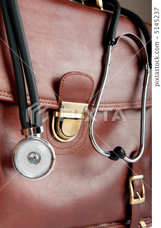 Doctor's brown leather case with the stethoscope 5145237