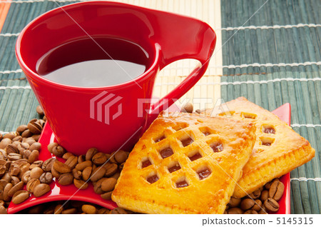 Cup of coffee with many beans around Cup of coffee with many beans around 5145315
