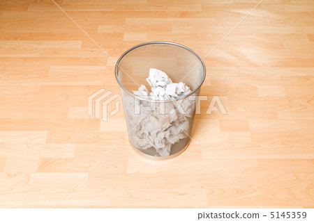 Garbage bin with paper waste isolated on white 5145359