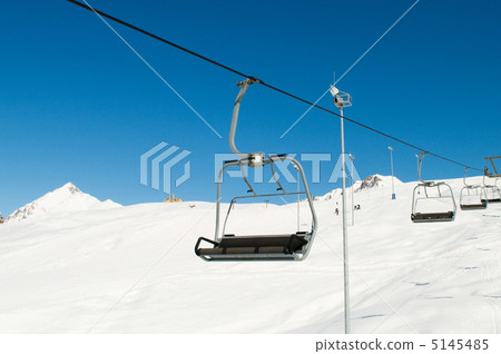 Ski lift chairs on bright winter day 5145485