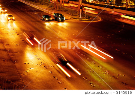 Moving traffic and car lights in the evening Moving traffic and car lights in the evening 5145916