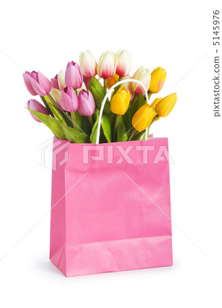 Tulips in shopping bag isolated on white Tulips in shopping bag isolated on white 5145976