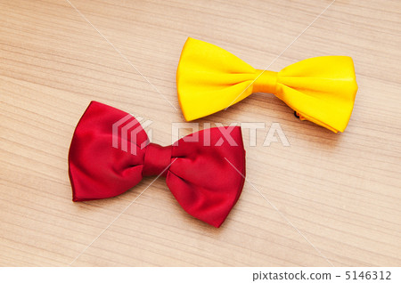 Two bow ties on the wooden background 5146312